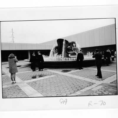 Graduates standing near fountain outside Convention Hall, Philadelphia Civic Center during 1971 graduation/commencement.