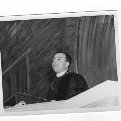 Edward Bunn, S.J., addressing audience during 1948 graduation/commencement in Barbelin quadrangle.