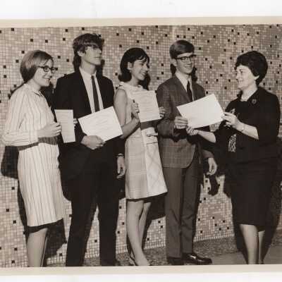Four high school students receiving certificates of merit from Rebecca Segal, School District of Philadelphia (?), for participating in Chemistry Department's Science Motivation Program, spring 1968.