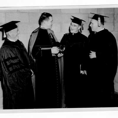 John J. Long, S.J. with honorary degree recipients as part of 1949 graduation/commencement ceremony. Other individuals include Joseph Breen, Monsignor Fury, and Father Cox.
