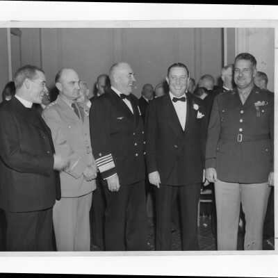 John J. Long, S.J., Senator Francis J. Myers and others at dinner event honoring Senator Myers on his election, November 21, 1945.