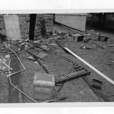 Exterior view of debris on ground outside of Simpson Hall after fire.