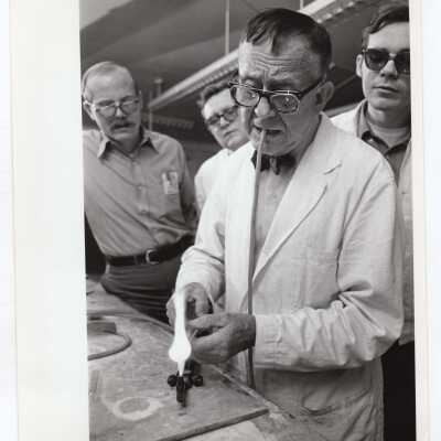 Students and professor in glass blowing course offered by Chemistry Department, c. 1965.