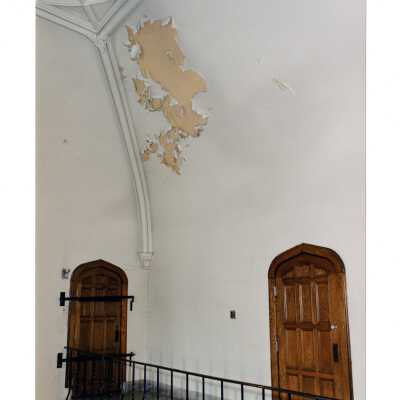Interior views of upper hallways in Barbelin Hall showing peeling paint prior to repainting project during summer 2003. Three color photographs.
