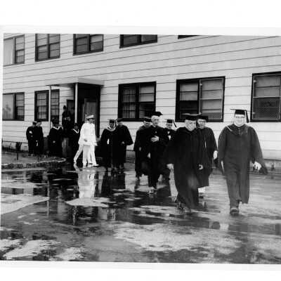 View of commencement procession in front of Cardboard College also known as Barbelin Annex.