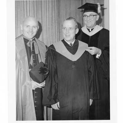 William F. Maloney, S.J., with two honorary degree recipients, Monsignor Edward T. Hughes and Raymond J. Petersen during October 1966 graduation/commencement.