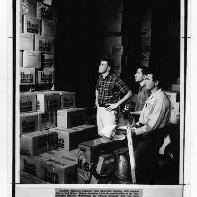 Three students in the Academy of Food Marketing--Clinton Kearney, John Eichmann, Donald Feldman--working at the Philadelphia Grocery Warehouse, c. 1965.