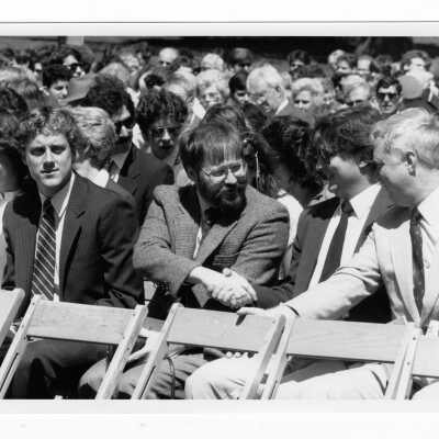 View of faculty, students, and guests at outdoor Baccalaureate service during graduation/commencement, c. 1985. Joseph Gower (?) included in photograph.