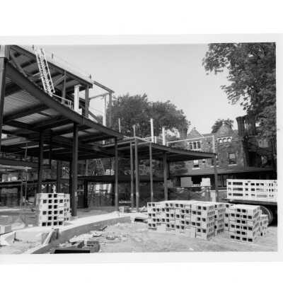 Exterior of view of early construction of Chapel of Saint Joseph with Wolfington Hall in background.