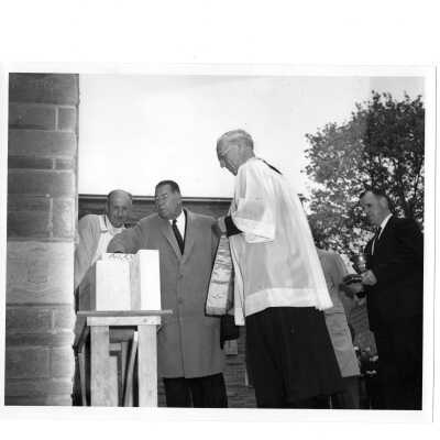 Blessing of Campion cornerstone with J. Joseph Bluett, S.J., Albert Dagit (architect), and Brother Boyle.