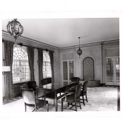 Interior view of sunroom and fountain in Regis Hall.