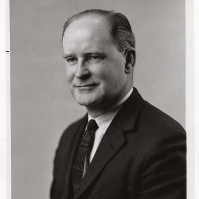 Photograph of James M. Quigley (Assistant Secretary of Department of Health, Education, and Welfare), special lecturer for Latin American Studies Program, c. 1965.