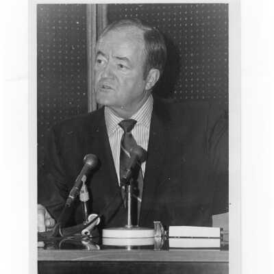 Vice President Hubert Humphrey seated at table speaking during his visit to SJC campus, January 27, 1970.