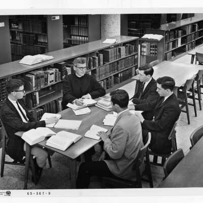 Jerome Coll, S.J., holding Honors Program class in Drexel Library, c. 1968.