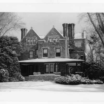View of west side of Wolfington Center (formerly Gest Estate, Neumann Hall) in snow before exterior renovation and porch rebuilding.