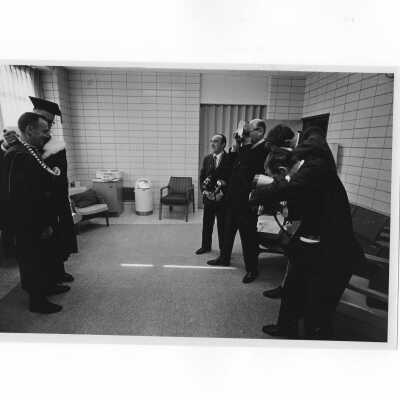 Inauguration of President Terrence Toland, S.J., November 14, 1968. Before ceremony, Toland poses for photographers with Jerome Coll, S.J.