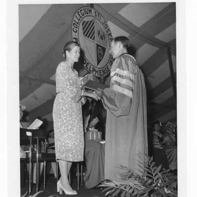 Terrence Toland, S.J., presenting gift to Princess Grace of Monaco during academic convocation held on Gest Lawn, July 31, 1976, as part of SJC 125th anniversary celebration.