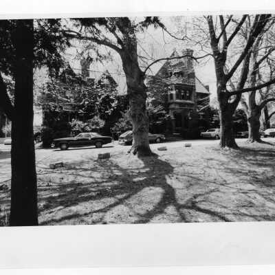Exterior view of Wolfington Center (formerly Gest Estate, Neumann Hall) with cars parked in front.