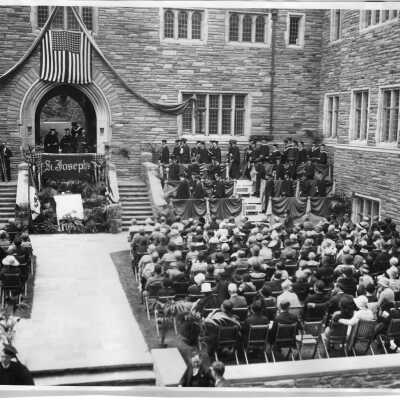 Commencement ceremony for the Class of 1928 in the Barbelin Hall courtyard.