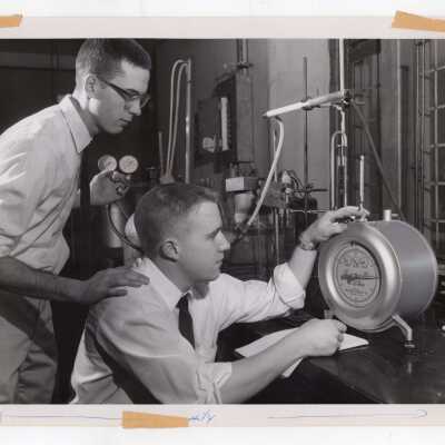 Two graduate chemistry students working in science laboratory, February 19, 1963.