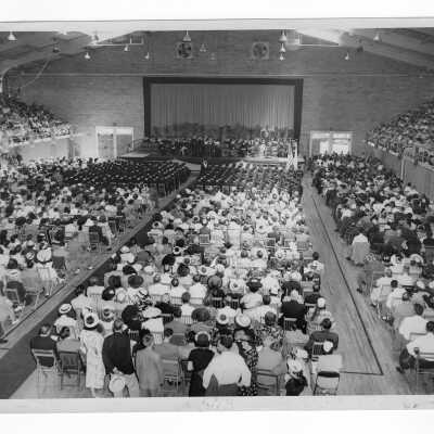 View of 1949 graduation/commencement ceremony in Field House, the first time event held in the Field House.