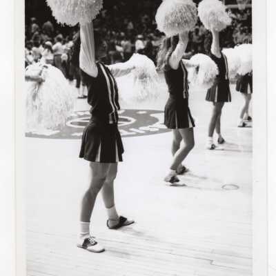 Women cheerleaders at basketball game.