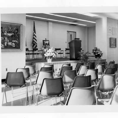 Interior view of lecture room and podium for science center dedication.