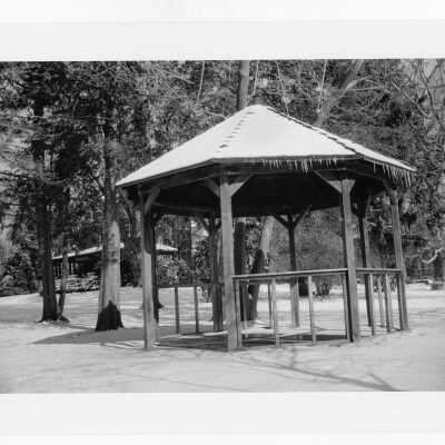 Gazebo of Gest Estate (now Wolfington Center) in winter with snow on ground. [not original structure; original made with tree limbs]