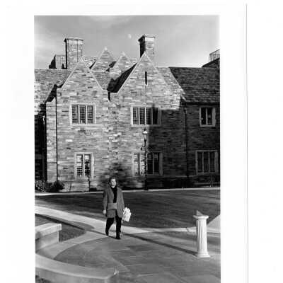 Woman walking near Barbelin near circle with sundial.