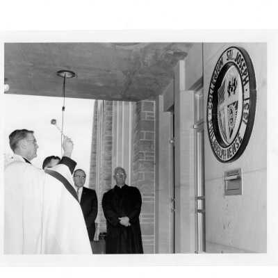 Blessing of new Drexel Library at front entrance with William F. Maloney, S.J., J. Joseph Bluett, S.J. and others.