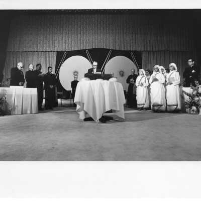 Dr. Thomas Melady introducing the bread breaking ceremony during International Eucharistic Congress, symposium on hunger, August 2, 1976, held at Philadelphia Civic Center.