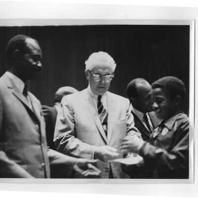 Francois Tombalbaye, President of Chad, and Mayor James Tate greeting child at reception following convocation, October 26, 1970.