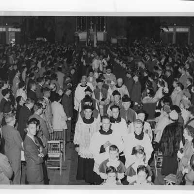 Recessional from pontifical mass for centennial celebration held in Field House, with Robert J. Gannon, S.J., Edward G. Jacklin, S.J., John J. Long, S.J., Monsignor Joseph McShea, Amleto Giovanni Cicognani.