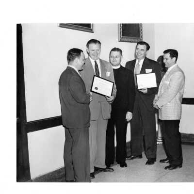 Alumni homecoming event, June 4, 1953, with Robert Cranage, Robert Larkin, Edward G. Jacklin, S.J., John Gillespioe, and William F. Ariano. Gillespie and Larkin received awards as football coaches at Northeast Catholic High School.