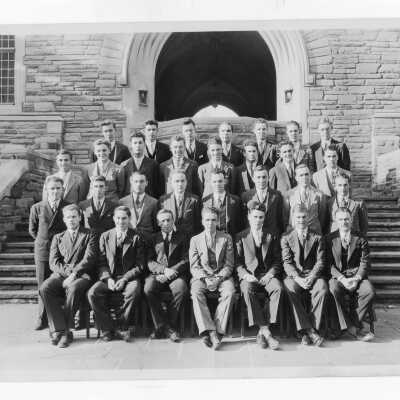 Members of Junior Week student committee seated in Barbelin Quadrangle.