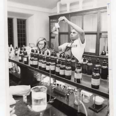 Two graduate chemistry students working in science laboratory, c. 1965.