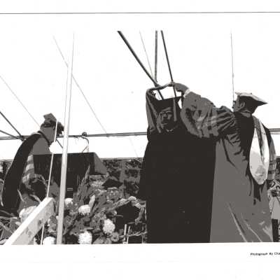 Donald I. MacLean, S.J., conferring honorary degree on U.S. Representative William H. Gray III during 1980 graduation/commencement.