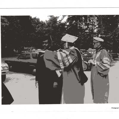 Donald I. MacLean, S.J. and Eugene McCreesh, S.J. (?) welcoming honorary degree recipient U.S. Representative William H. Gray III during 1980 graduation/commencement.
