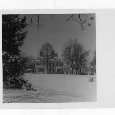 Exterior view of Loyola Hall, Jesuit Residence, in snow.