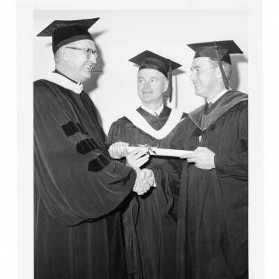 William F. Maloney, S.J., with two honorary degree recipients during 1967 graduation/commencement.