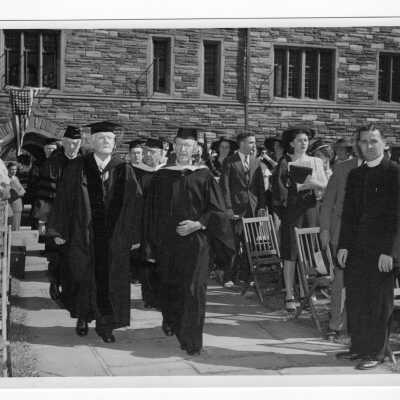 Four graduates from the class of 1896 receiving gold medal awards at 1946 graduation/commencement ceremony processing with others into Barbelin Quadrangle. Alumni included: John J. Sullivan, Samuel J. Magarge, John T. Heron, J. Vincent Crowne.
