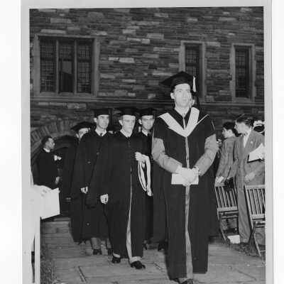 Students and faculty processing into Barbelin quadrangle during 1947 graduation/commencement ceremony.