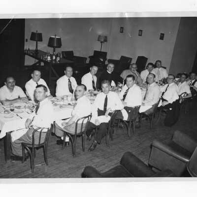 Alumni association members and Joseph S. Hogan, S.J., at dinner meeting, c. 1946.
