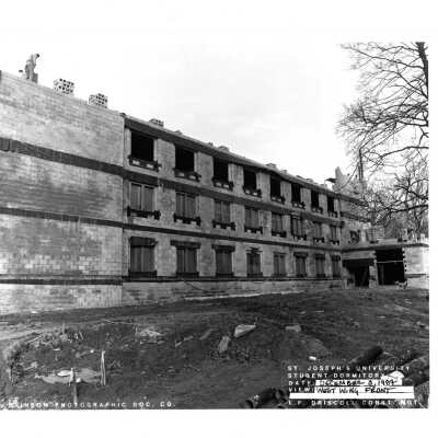 View of McShain Hall construction with workman.