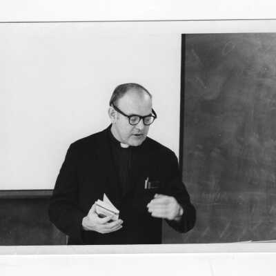 Jon O'Brien, S.J. (Theology) teaching in classroom.