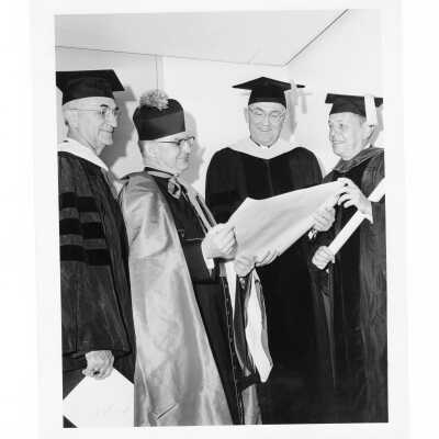 William F. Maloney, S.J., with three honorary degree recipients, Allen H. Wetter, Monsignor Anthony L. Ostheimer, and Richard C. Bond at October 1964 commencement/graduation.