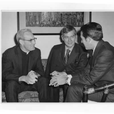 Senator Mark Hatfield speaking with Michael Smith, S.J., and another individual prior to delivering speech to SJC campus, October 4, 1970.
