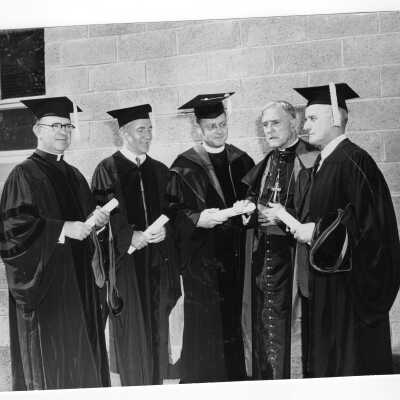Edward G. Jacklin, S.J. with four honorary degree recipients, John McShain, Reverend John J. Maher, Bishop Daniel f. Gercke, and John J. Hearne at 1953 graduation/commencement.