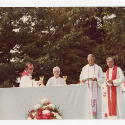 Thomas F. Gleeson, S.J. and others at Mass during dedication of Sourin Residence Center.