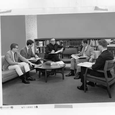 Thomas Loughrey, S.J., having discussion with Honors Program class in Drexel Library, c. 1970.